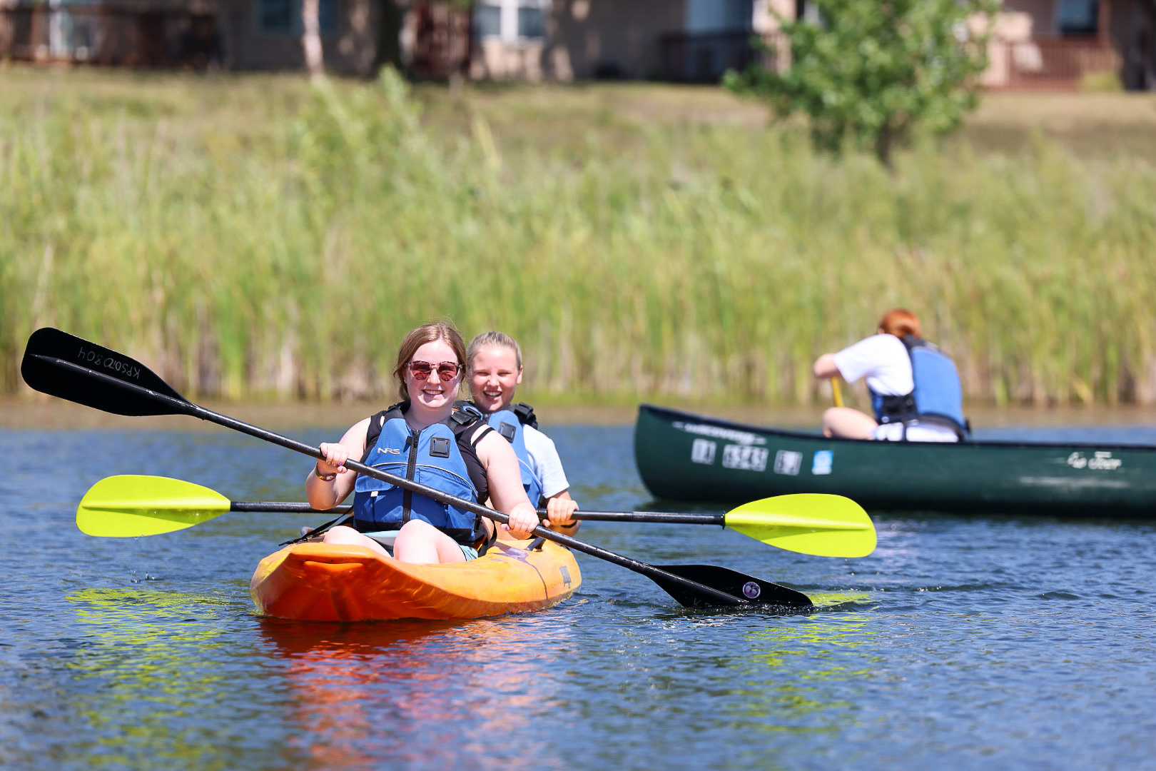 students canoeing on North pond.
