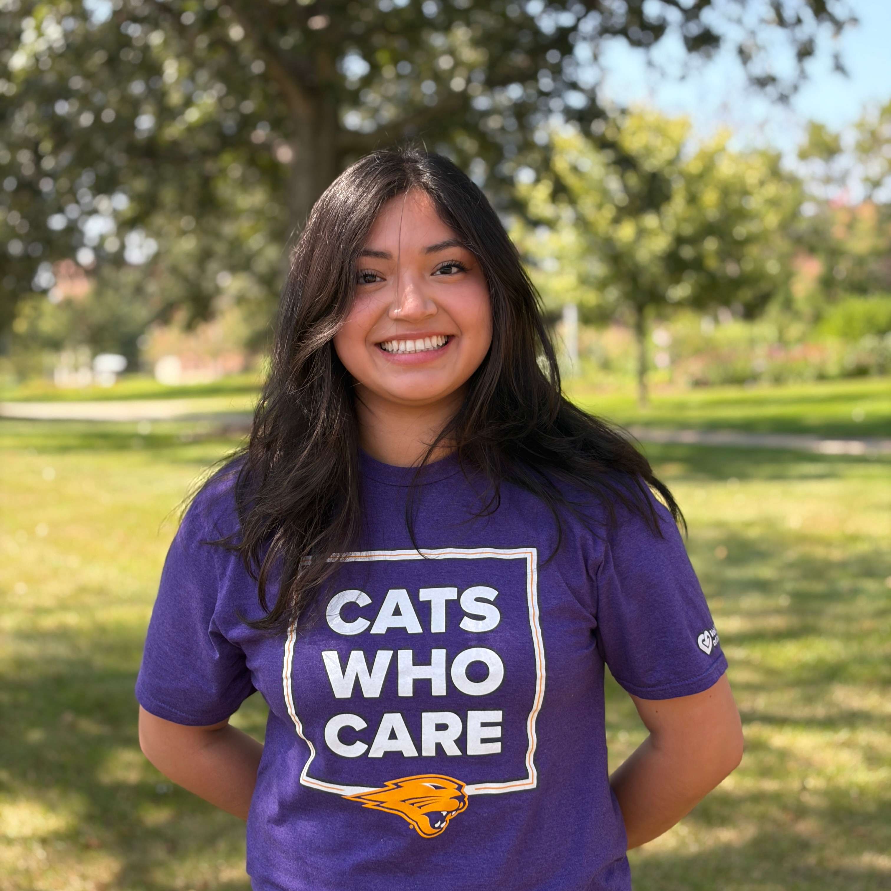 Estefany smiling wearing purple shirt