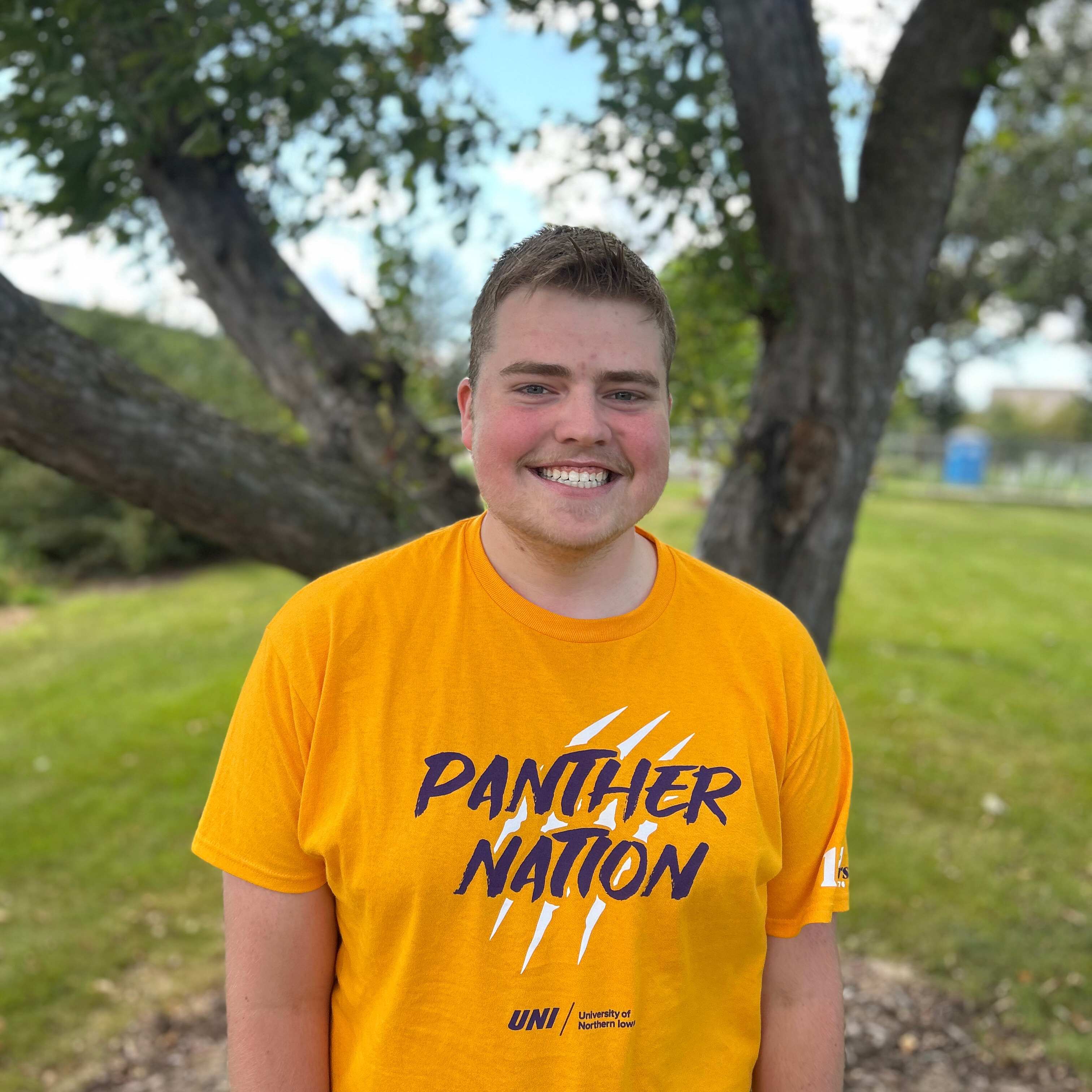 holden wearing gold panther nation shirt