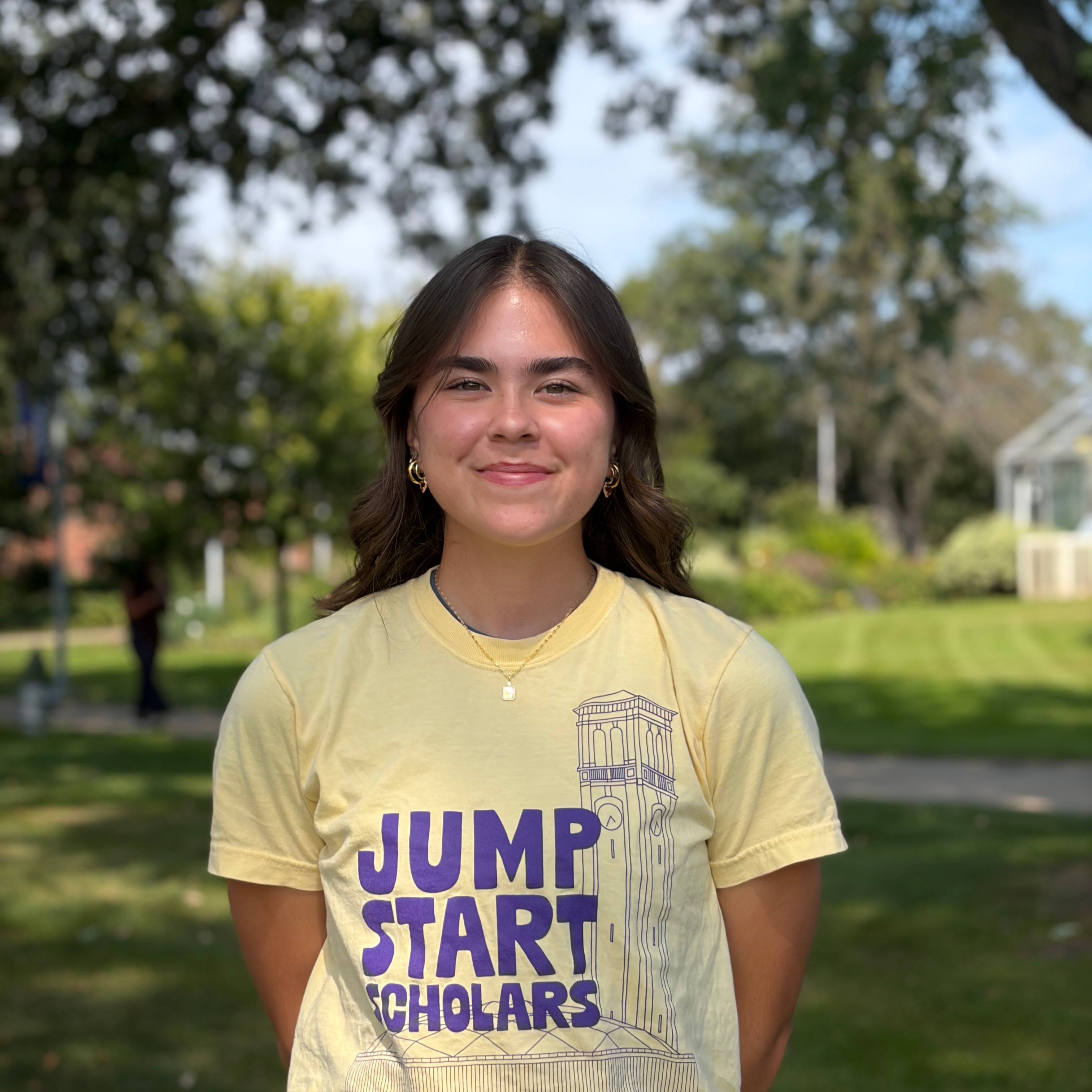 Jesika smiling wearing yellow shirt