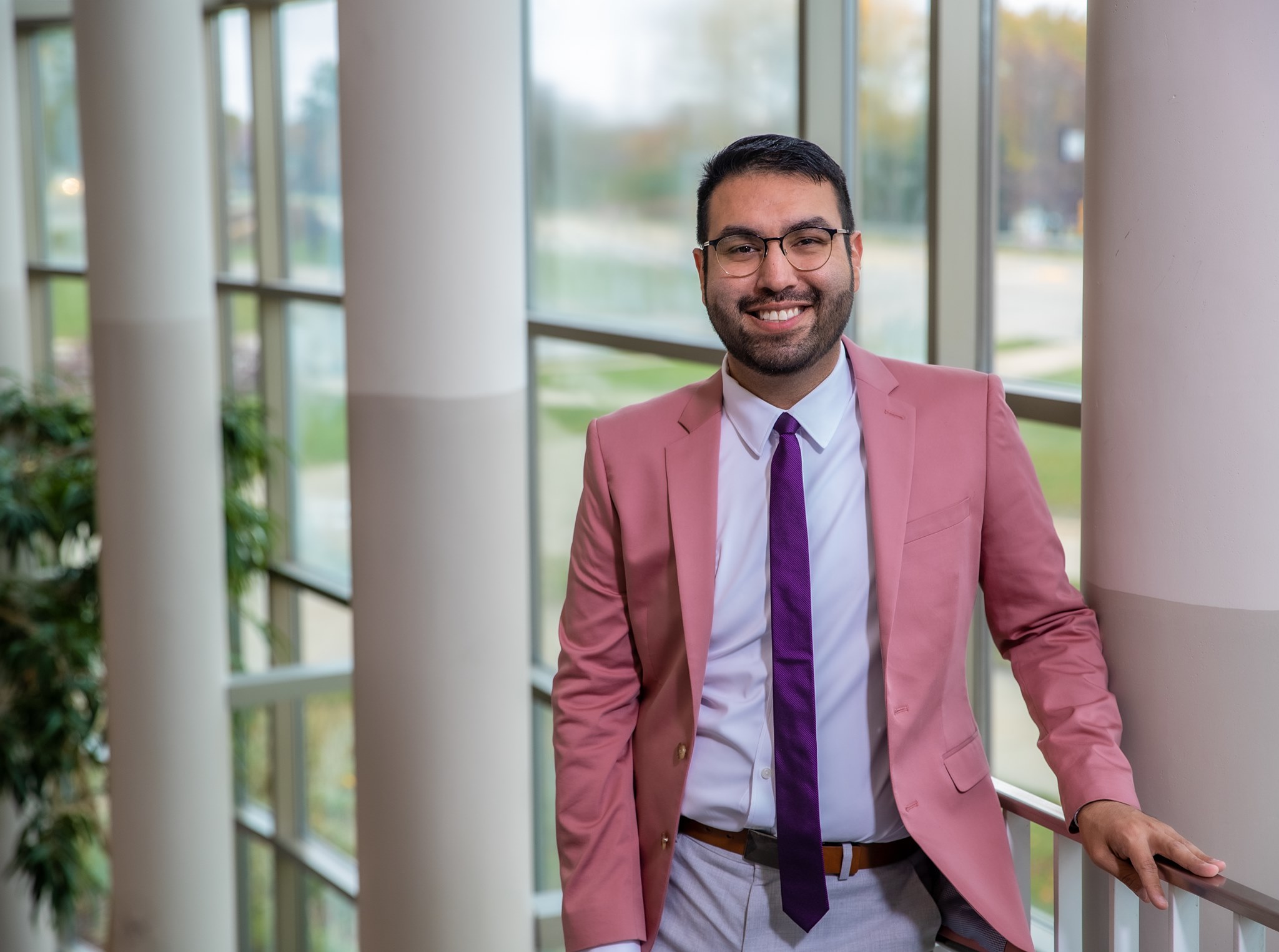 jesus wearing pink jacket and purple tie