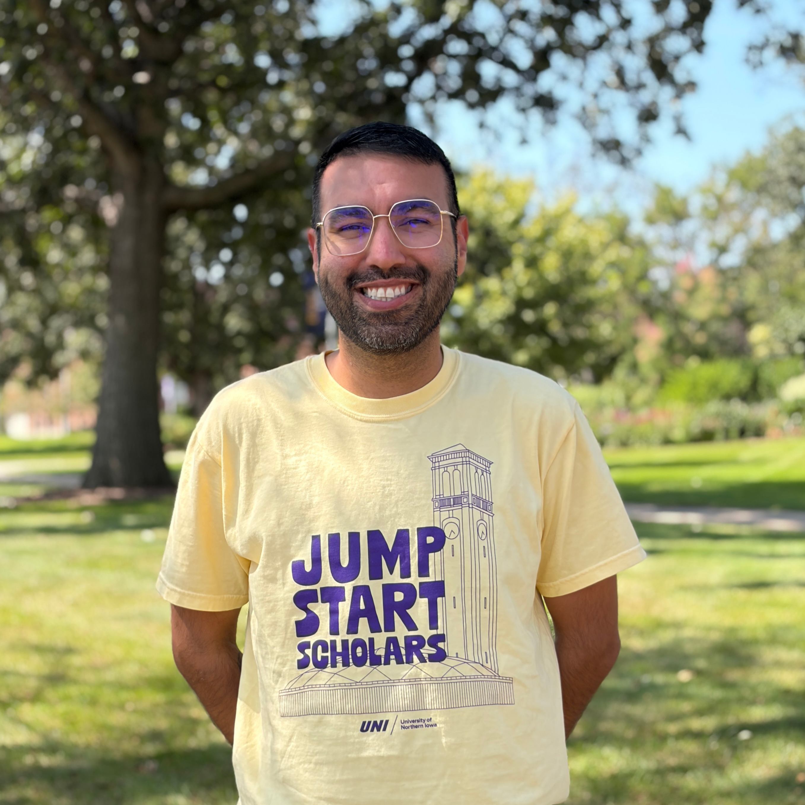 Jesús smiling wearing yellow shirt