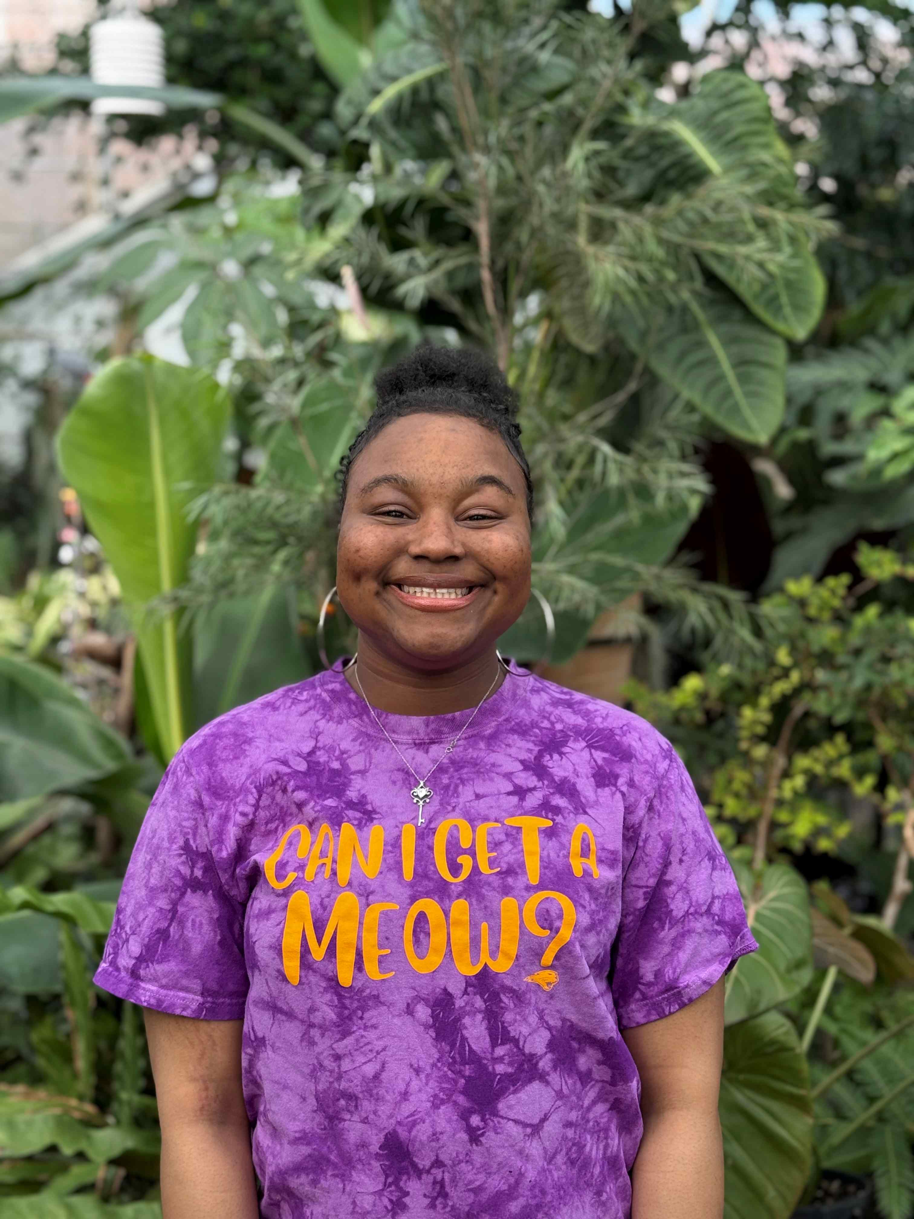 Keymora wearing purple shirt