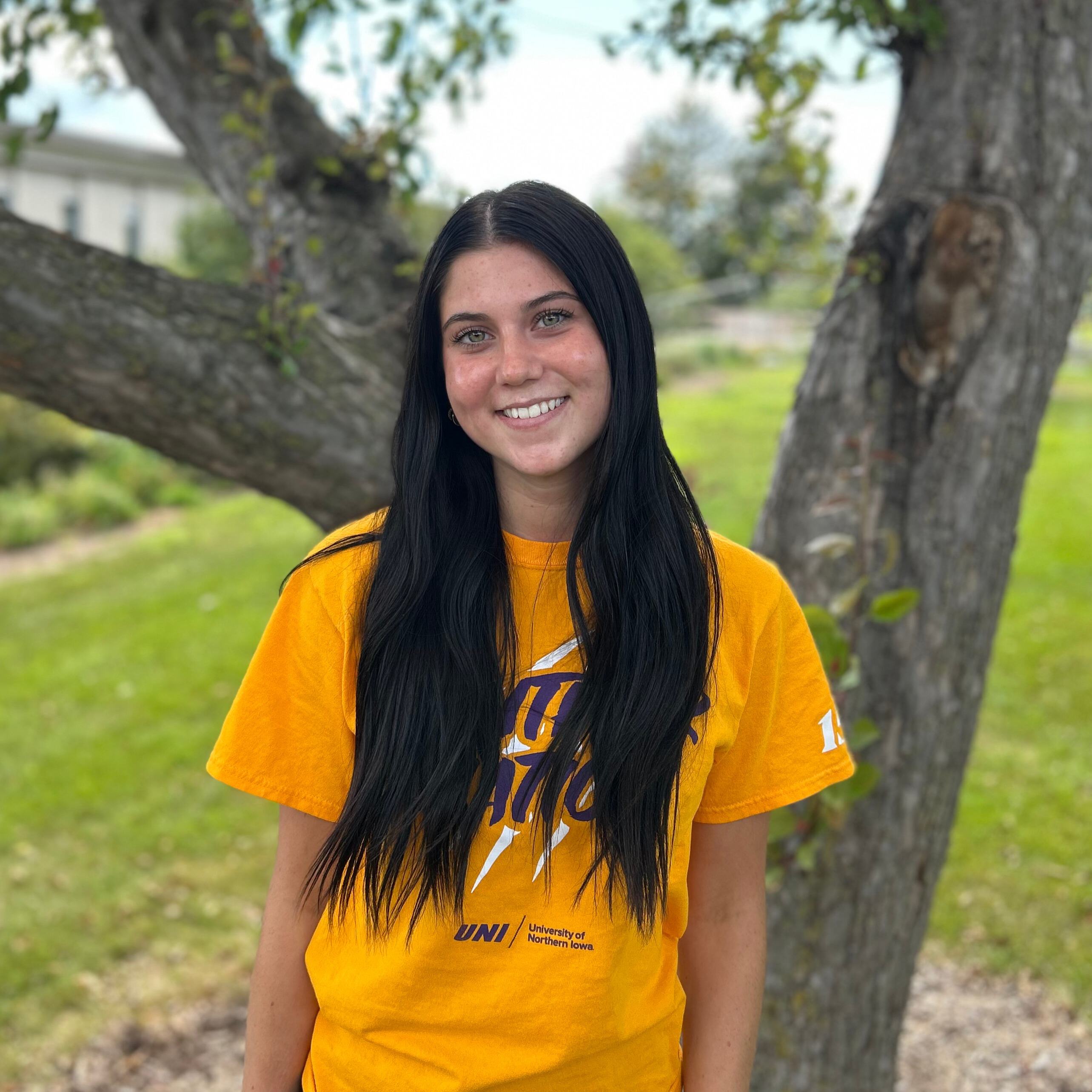 Lillie wearing gold panther nation shirt