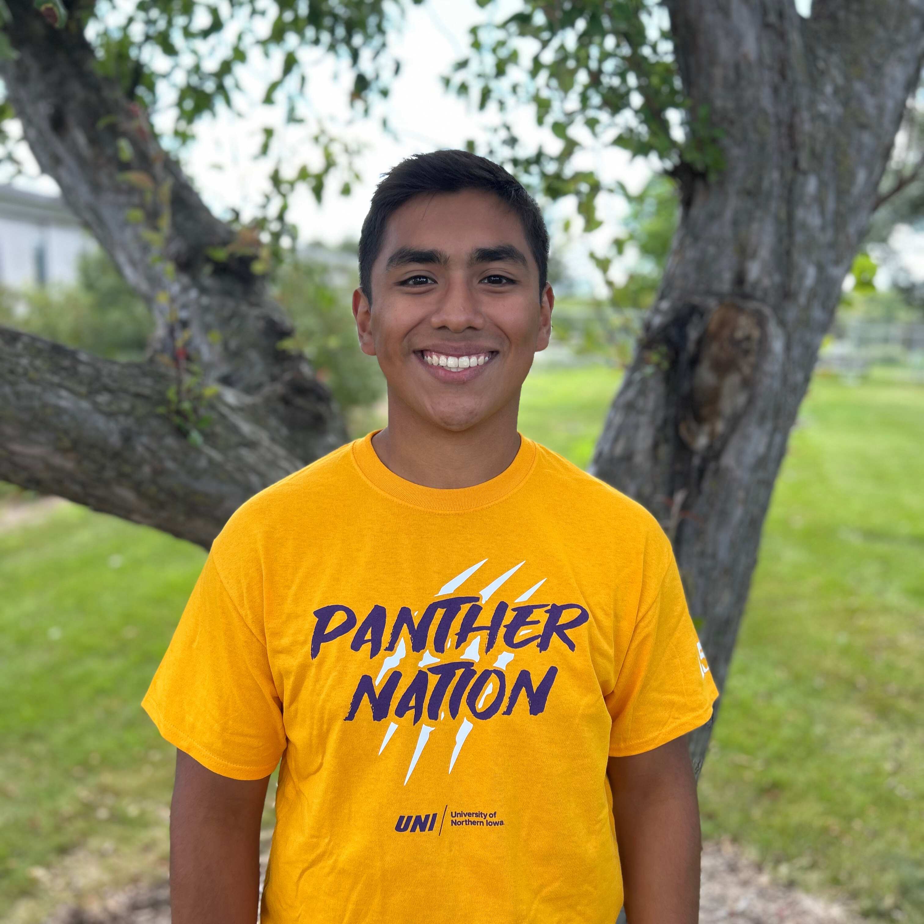 Randy wearing gold panther nation shirt