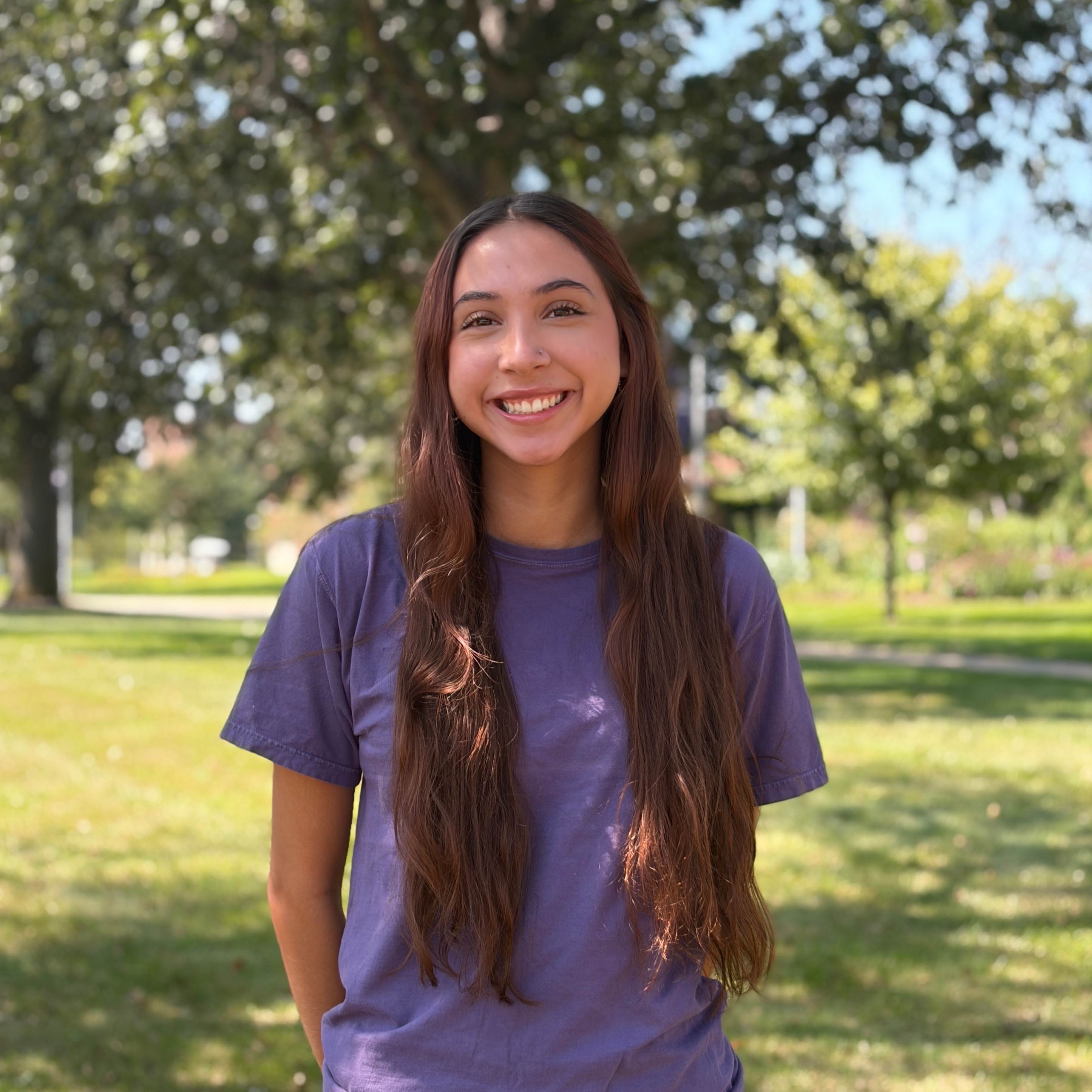 Stephanie smiling wearing purple shirt