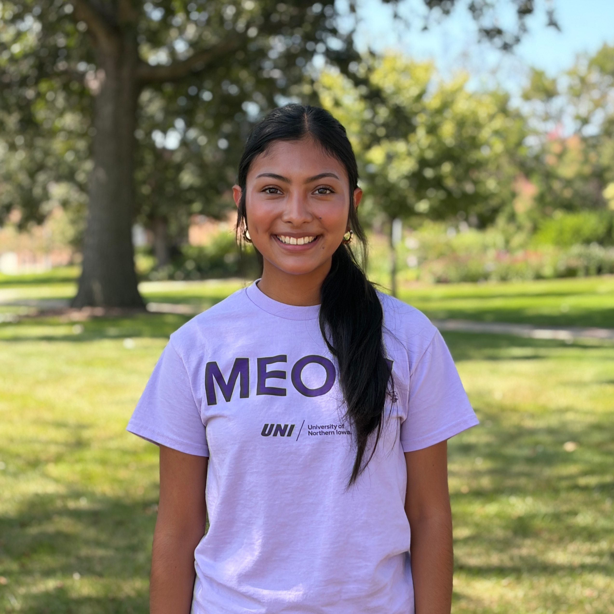 Zoe smiling wearing purple shirt