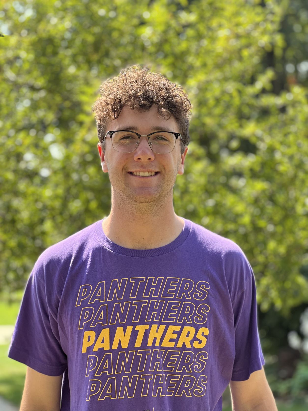 Braden in a purple UNI shirt.