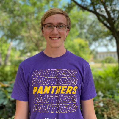 Gavin wearing a purple panthers t-shirt