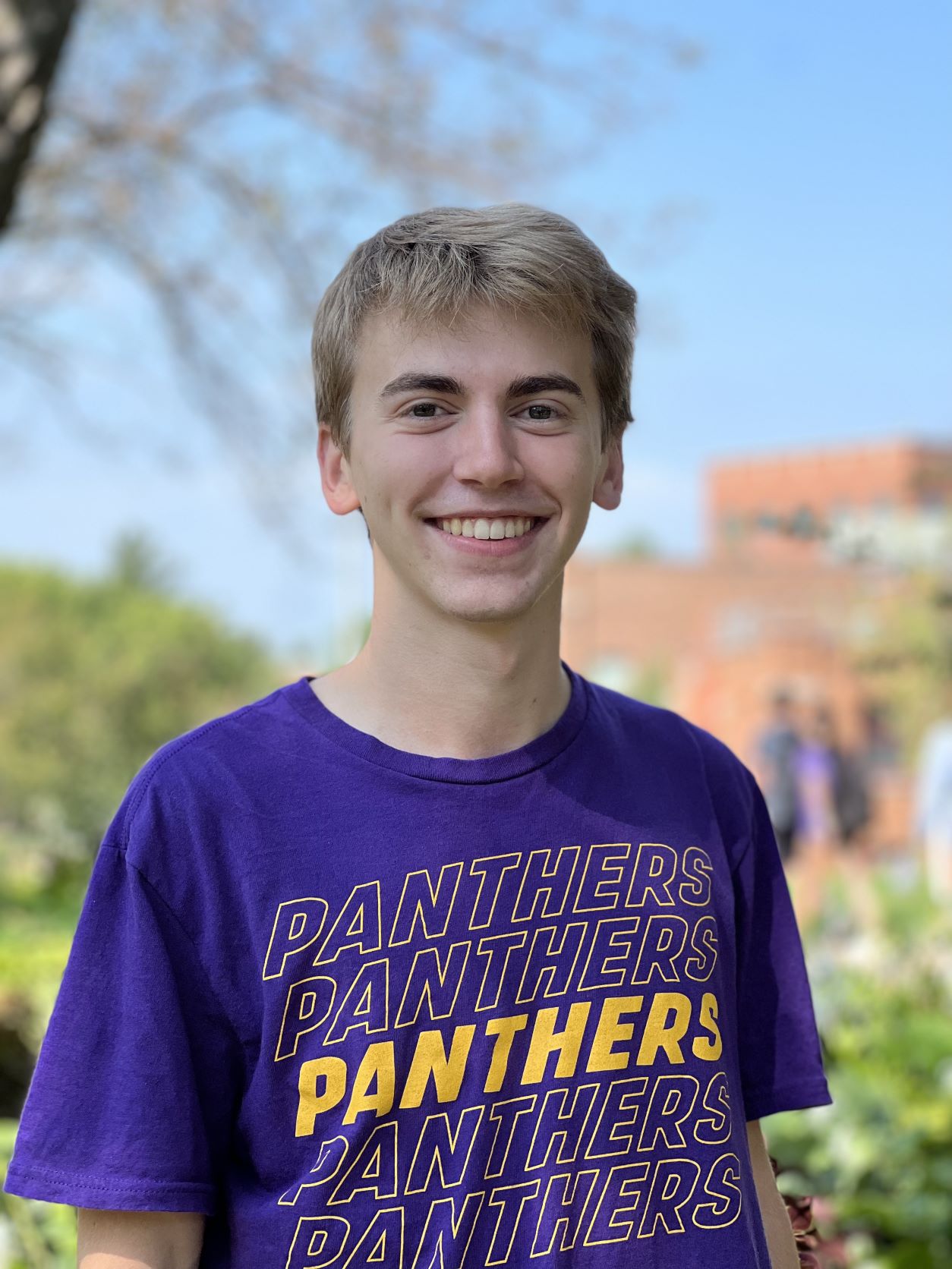 Grant wearing a purple UNI shirt. 