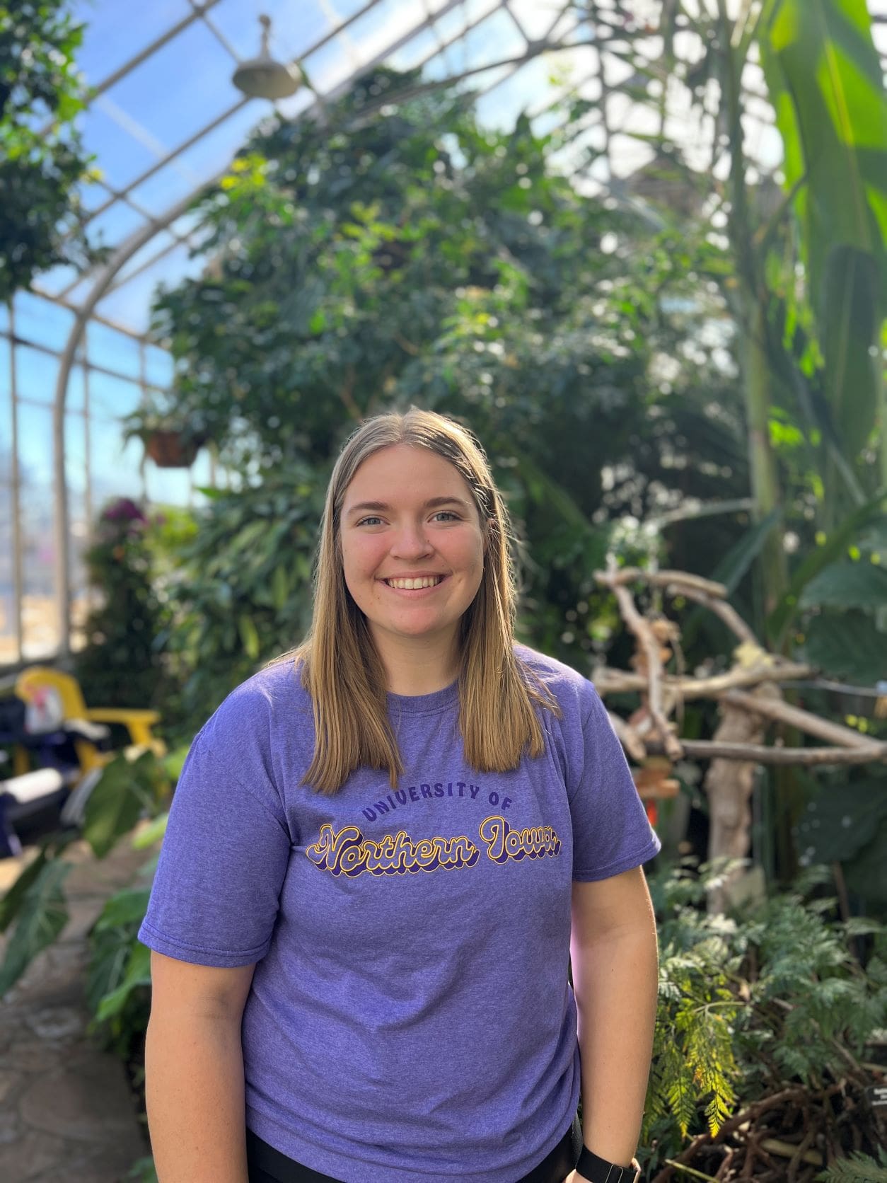 Maddie wearing a purple shirt that reads University of Northern Iowa. 