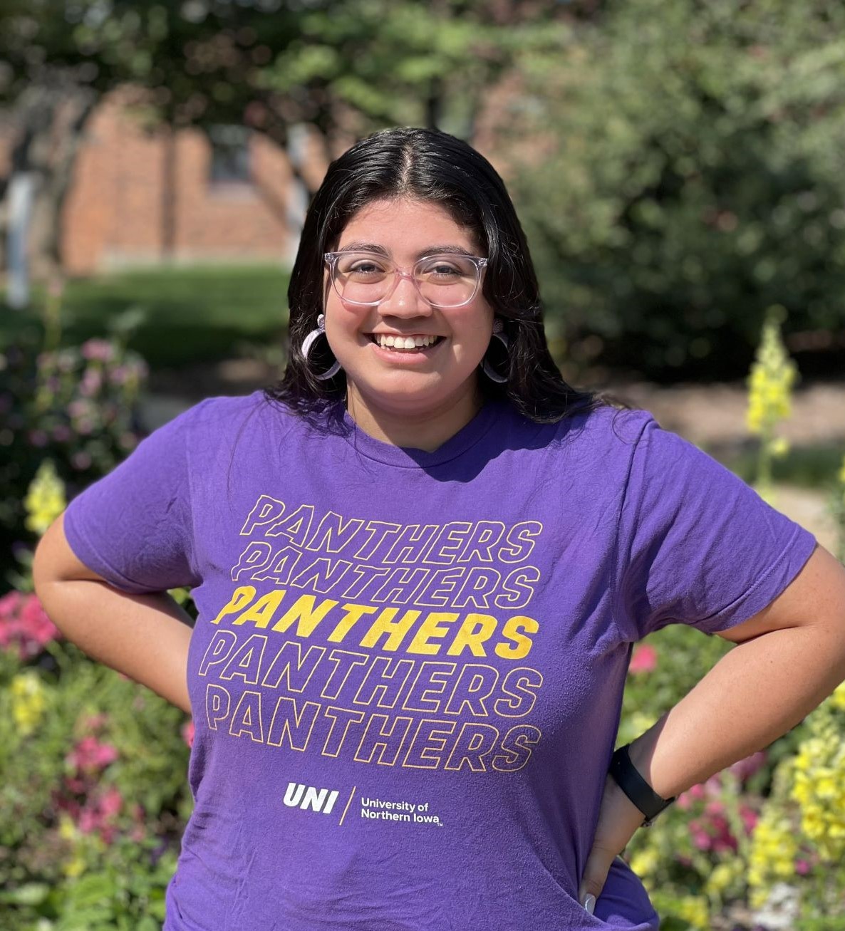 Yessenia in a purple UNI shirt. 