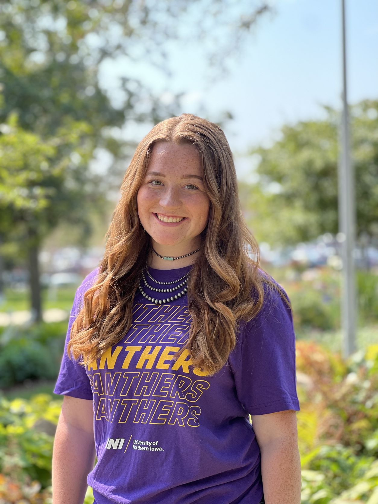 Maddie wearing a purple shirt. 