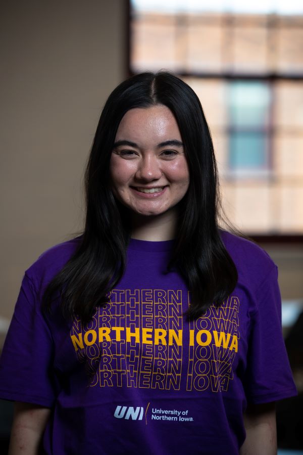 Madison wearing purple UNI t-shirt