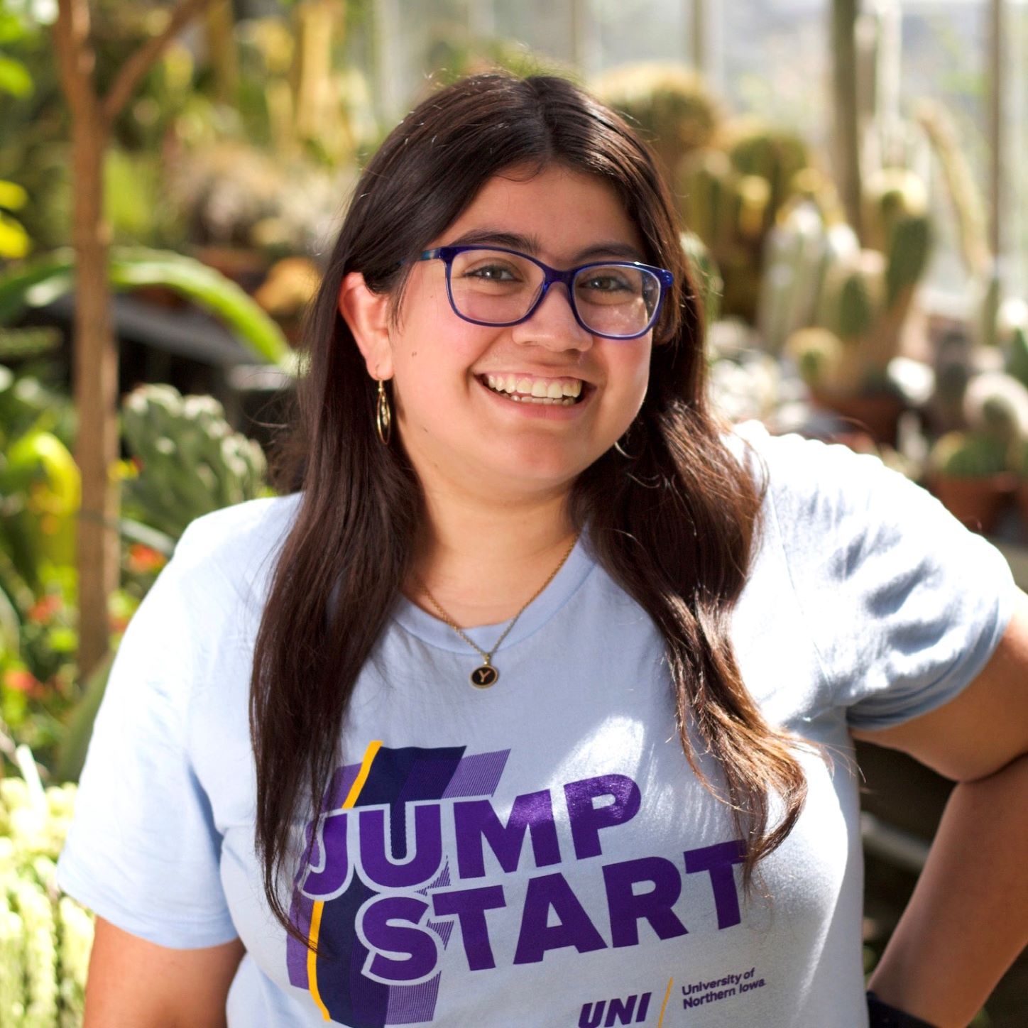 Yessenia wearing a blue JS t-shirt