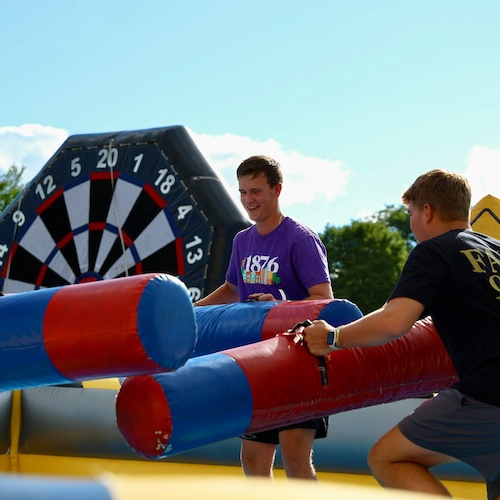 Students playing on an inflatable during Panther Welcome.