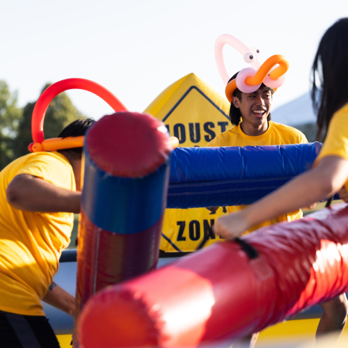 Students playing on an inflatable.